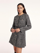 a curvy lady in black  tweed a-lined dress